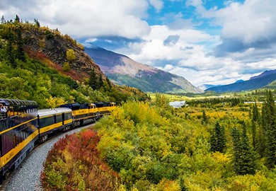 Alaska Railroad Traveling Through Mountains