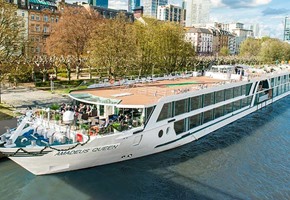 River ship docked along city river