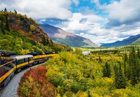 Train travelling through mountains in Alaska