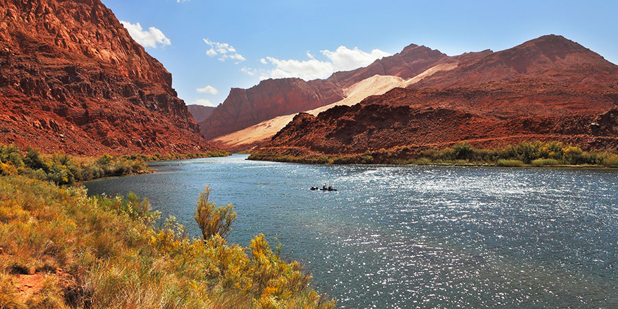 Colorado River Among The Rocky Mountains Of Red Sandstone