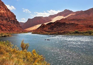 Colorado River Among The Rocky Mountains Of Red Sandstone