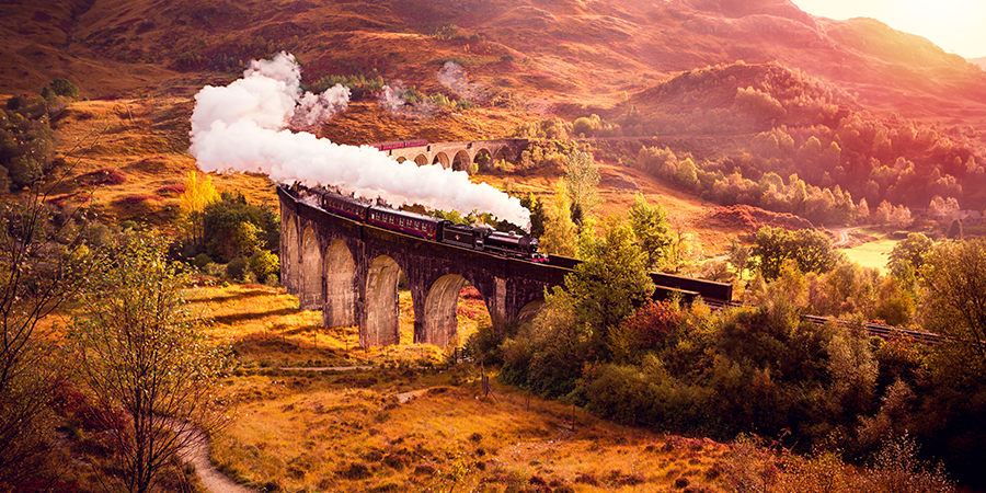 Historical Steam Train is crossing the Glenfiann Viaduct