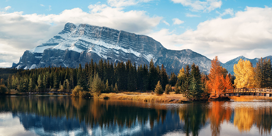 Two Jack lake with snow mountain Autumn foliage