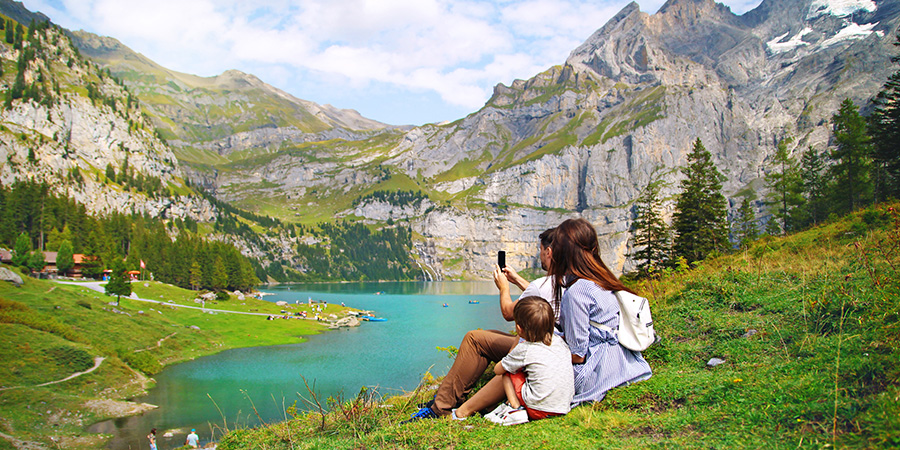 Family Of Tourists In Switzerland 