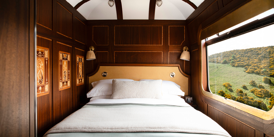 The beautiful cabin onboard the Royal Scotsman is decorated with ornate wood paneling.
